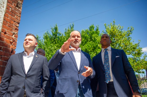Ryan Mackenzie, left, Charlie Jefferson and Scott Turner tour Adams Street in Bethlehem on Wednesday, July 8, 2026. The visit focused on the U.S. Department of Housing and Urban Development's mission, including opportunity zones, housing affordability and community investment. (Jonathan Broady/Special to The Morning Call)