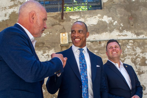 Charlie Jefferson, left, Scott Turner and Ryan Mackenzie tour Adams Street in Bethlehem on Wednesday, July 8, 2026. The visit focused on the U.S. Department of Housing and Urban Development's mission, including opportunity zones, housing affordability and community investment. (Jonathan Broady/Special to The Morning Call)