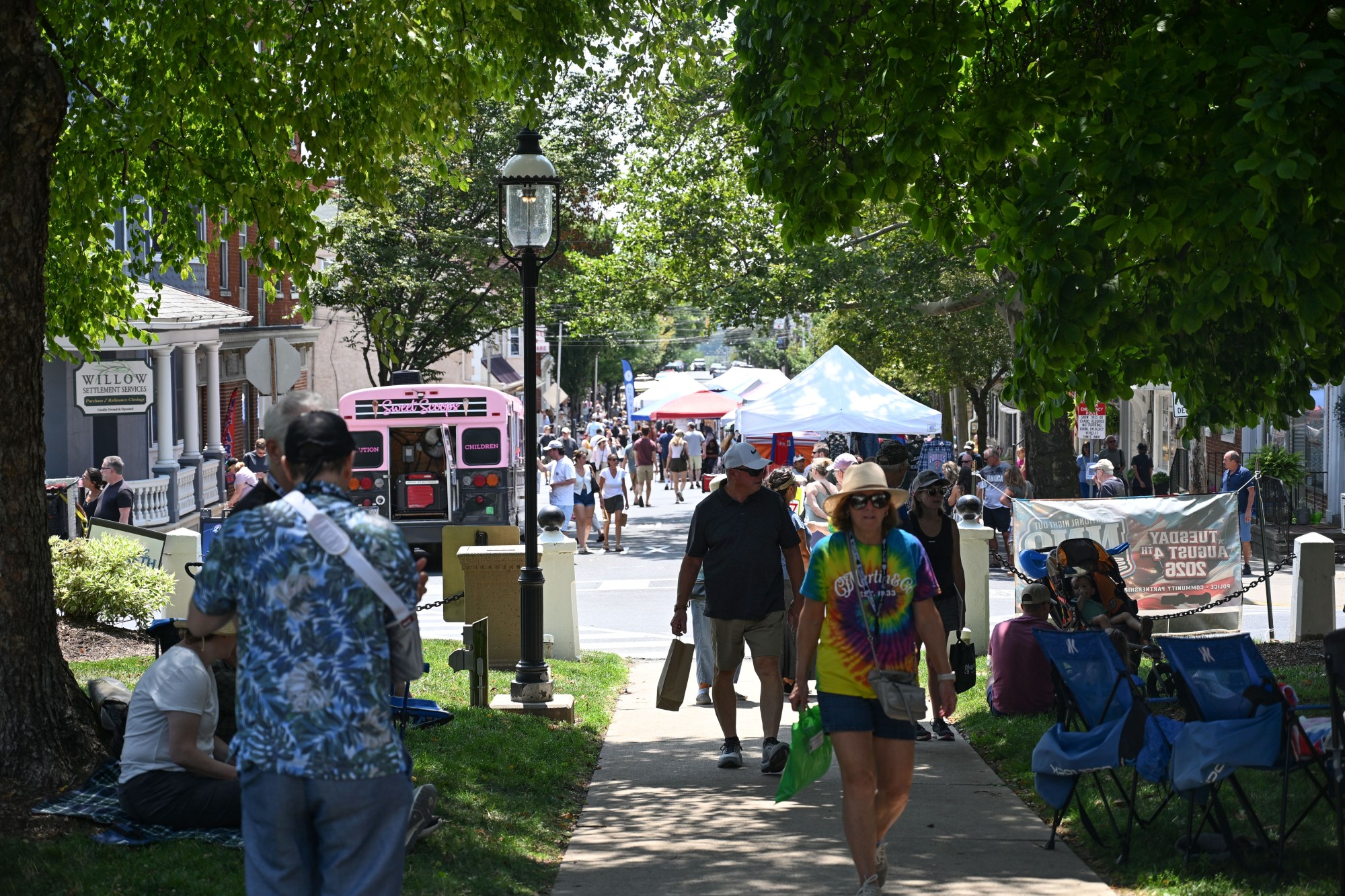 People walk through the annual Martin on Main street fair Saturday, July 25, 2026, in Nazareth. (Jon Chiu/The Morning Call)