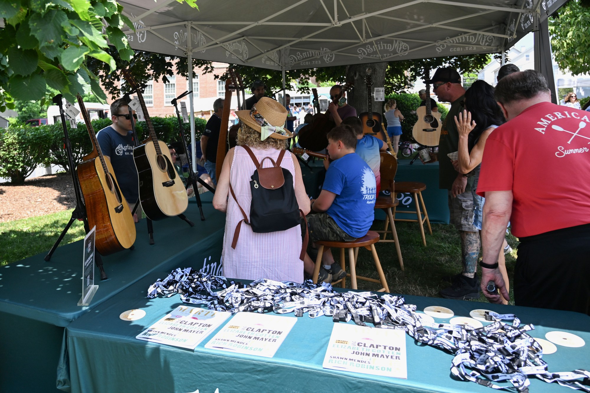 People inspect guitars made by C.F. Martin & Co. during the annual Martin on Main street fair Saturday, July 25, 2026, in Nazareth. (Jon Chiu/The Morning Call)