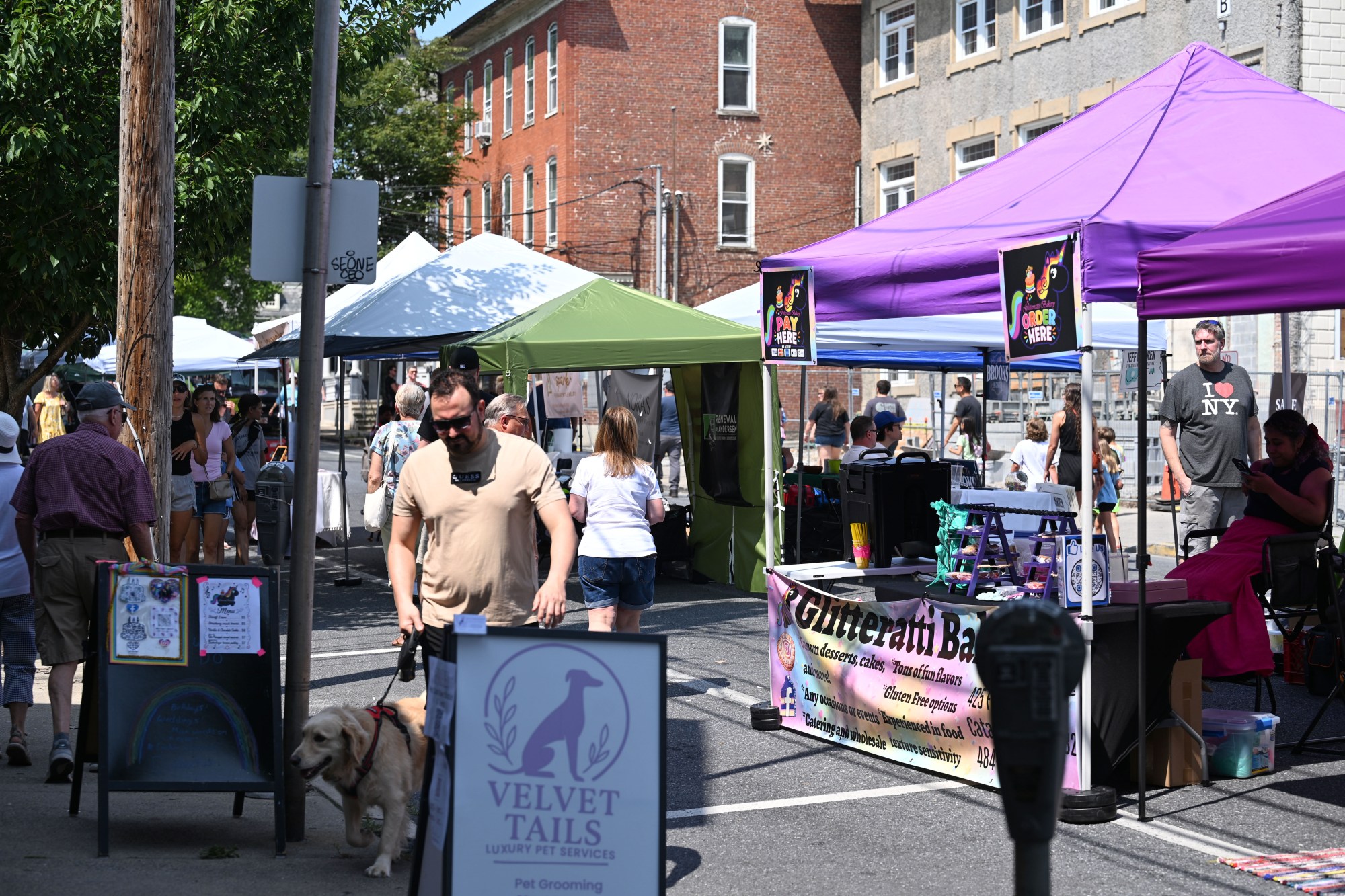 People walk among tents during the annual Martin on Main street fair Saturday, July 25, 2026, in Nazareth. (Jon Chiu/The Morning Call)