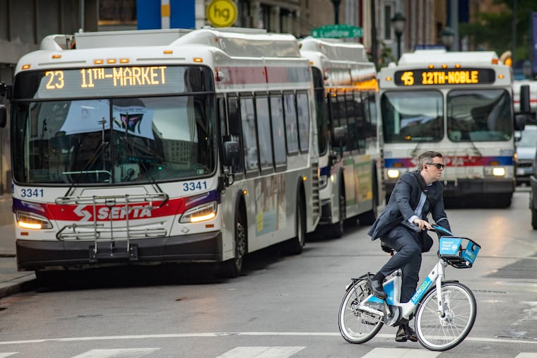 A commuter rides an Indego bike in Center City. The bike share program may see its first expansion outside of city lines to Lower Merion Township.