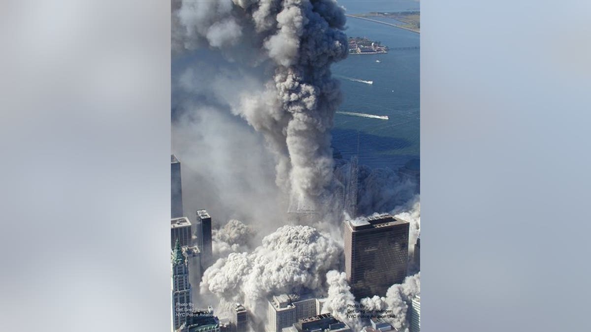 In this Sept. 11, 2001 photo made by the New York City Police Department and provided by ABC News, Tuesday Feb. 9, 2010 a World Trade Center tower implodes in New York, after terrorists flew two airliners into the towers. (AP Photo/NYPD, via ABC News, Det. Greg Semendinger ) MANDATORY CREDIT