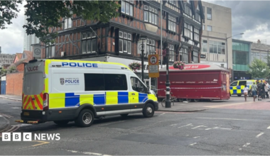 A general view picture of a police van parked up in Hosier Street, Reading, which is partly cordoned off with police tape.