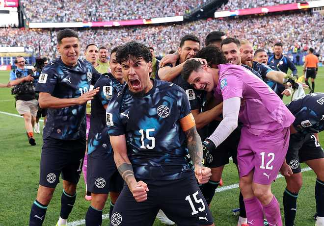 Germany v Paraguay: Round Of 32 - FIFA World Cup 2026 FOXBOROUGH, MASSACHUSETTS - JUNE 29: Gustavo Gomez #15 of Paraguay celebrates with teammates after Jose Canale #13 scores the winning penalty in a penalty shootout during the FIFA World Cup 2026 Round Of 32 match between Germany and Paraguay at Boston Stadium on June 29, 2026 in Foxborough, Massachusetts. (Photo by Alexander Hassenstein/Getty Images)