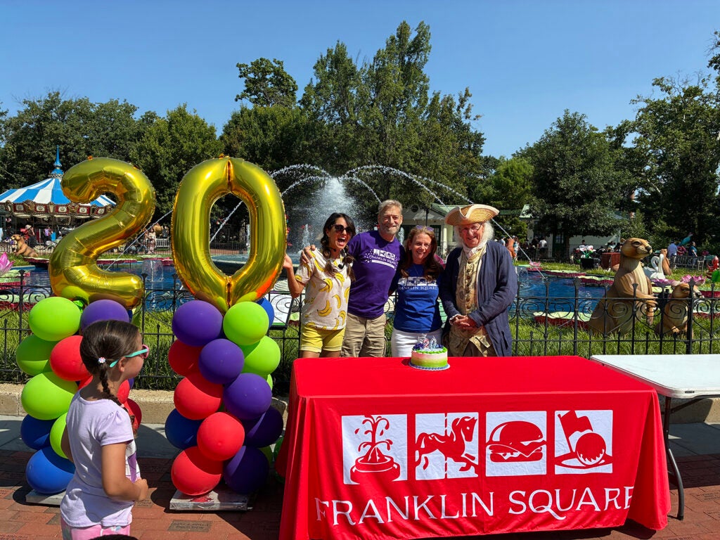 People celebrate the 20th anniversary of the rehabilitation of Franklin Square Park