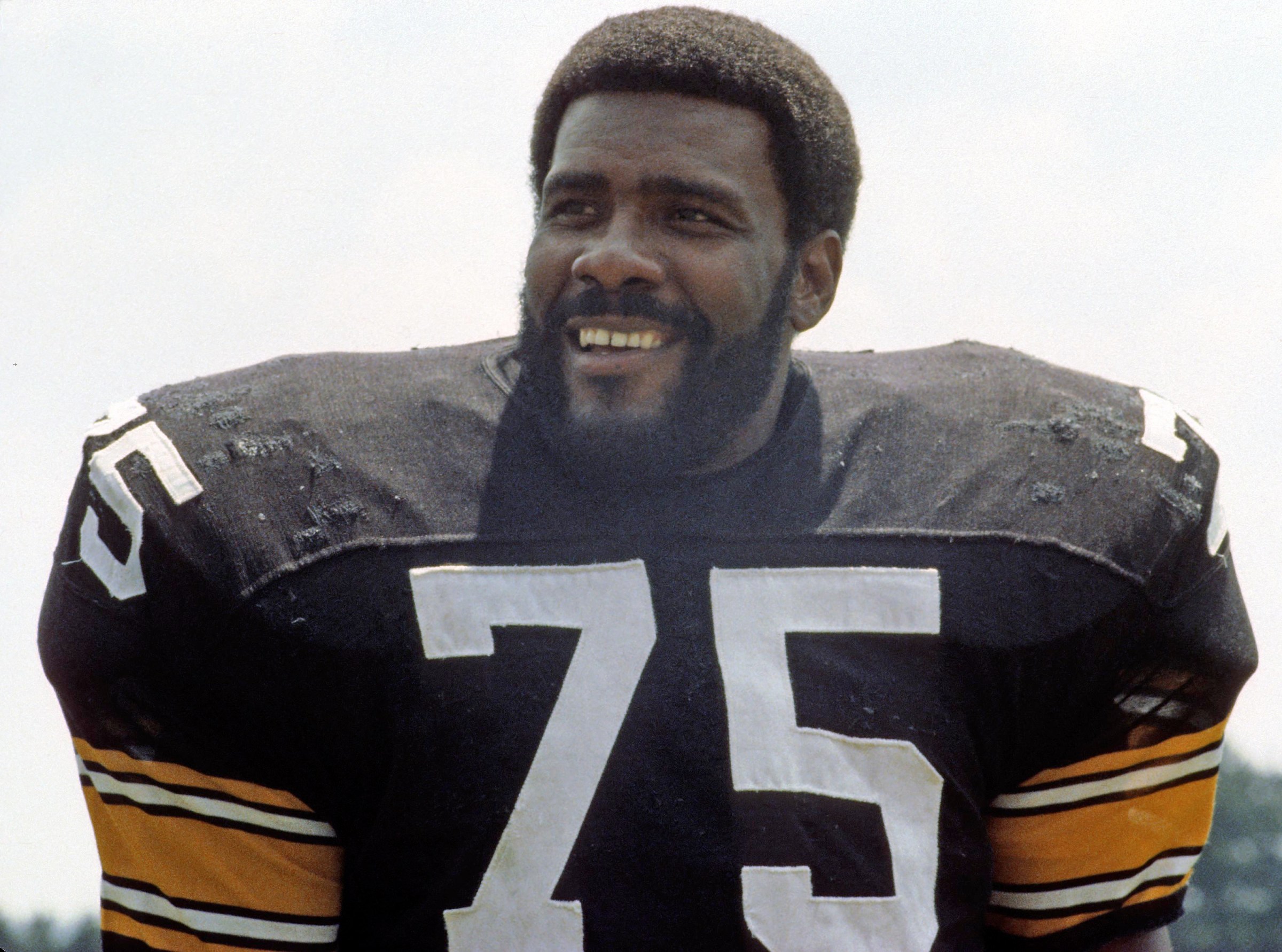 LATROBE, PA - JULY 1980: Defensive lineman Joe Greene #75 of the Pittsburgh Steelers smiles as he poses for a photograph on media photo day at summer training camp at Saint Vincent College in July 1980 in Latrobe, Pennsylvania. (Photo by George Gojkovich/Getty Images)