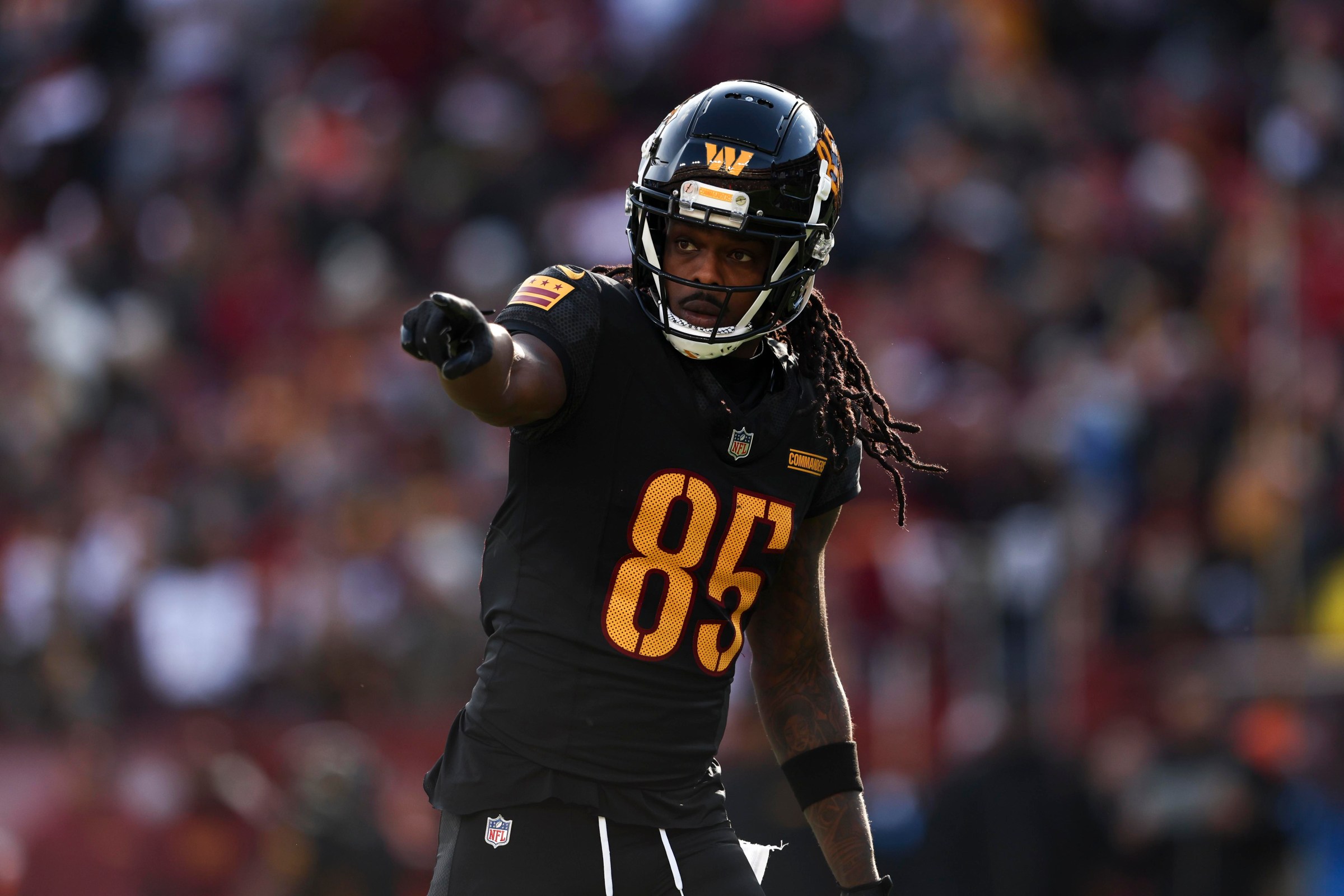 LANDOVER, MARYLAND - DECEMBER 01: Noah Brown #85 of the Washington Commanders gestures during a game against the Tennessee Titans at Northwest Stadium on December 01, 2024 in Landover, Maryland. The Commanders defeated the Titans 42-19. (Kara Durrette/Getty Images)