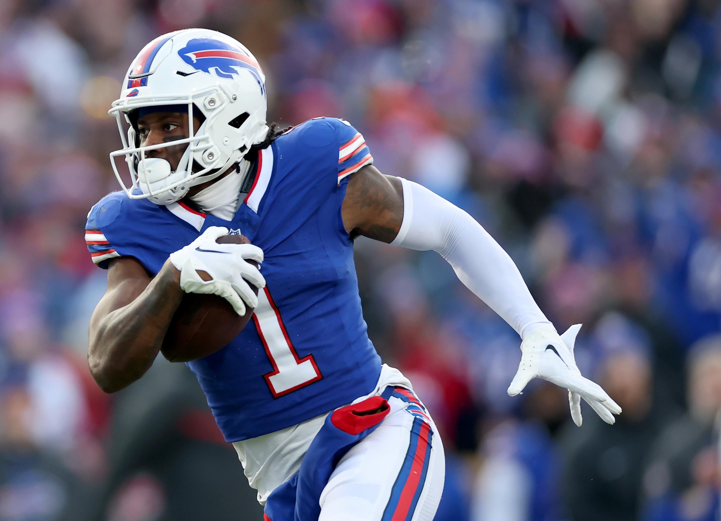 ORCHARD PARK, NEW YORK - JANUARY 12: Curtis Samuel #1 of the Buffalo Bills carries the ball in for a touchdown in the fourth quarter against the Denver Broncos during the AFC Wild Card Playoffs at Highmark Stadium on January 12, 2025 in Orchard Park, New York. (Photo by Elsa/Getty Images)