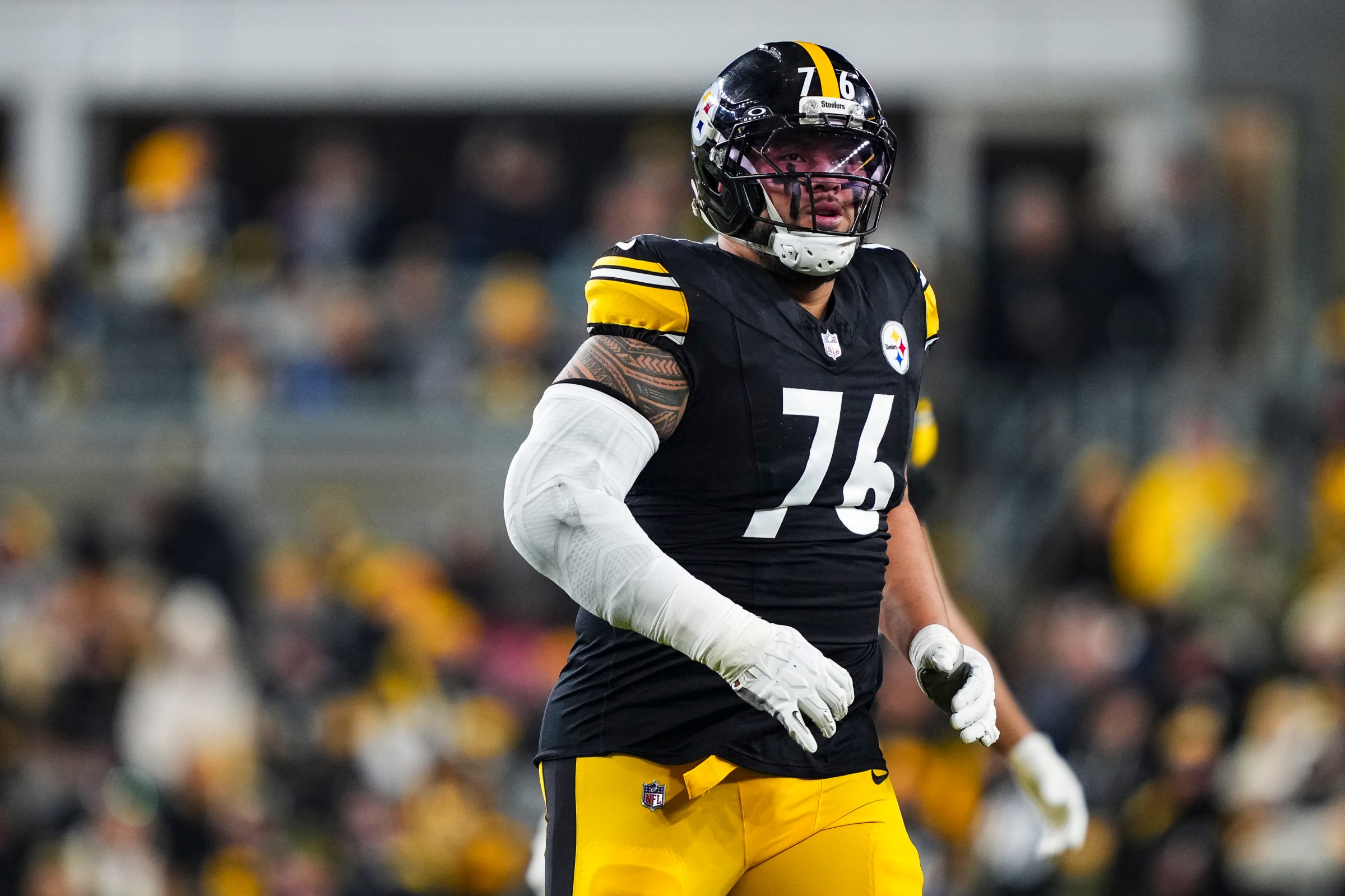 PITTSBURGH, PENNSYLVANIA - JANUARY 12: Troy Fautanu #76 of the Pittsburgh Steelers runs across the field during an NFL wild card playoff football game against the Houston Texans at Acrisure Stadium on January 12, 2026 in Pittsburgh, Pennsylvania. (Photo by Perry Knotts/Getty Images)