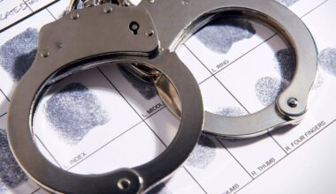Woman accused of threatening taxi driver with knife
