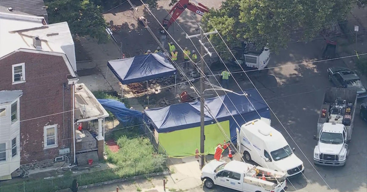 Police excavate pipes around house in Philadelphia's Olney neighborhood as investigation continues