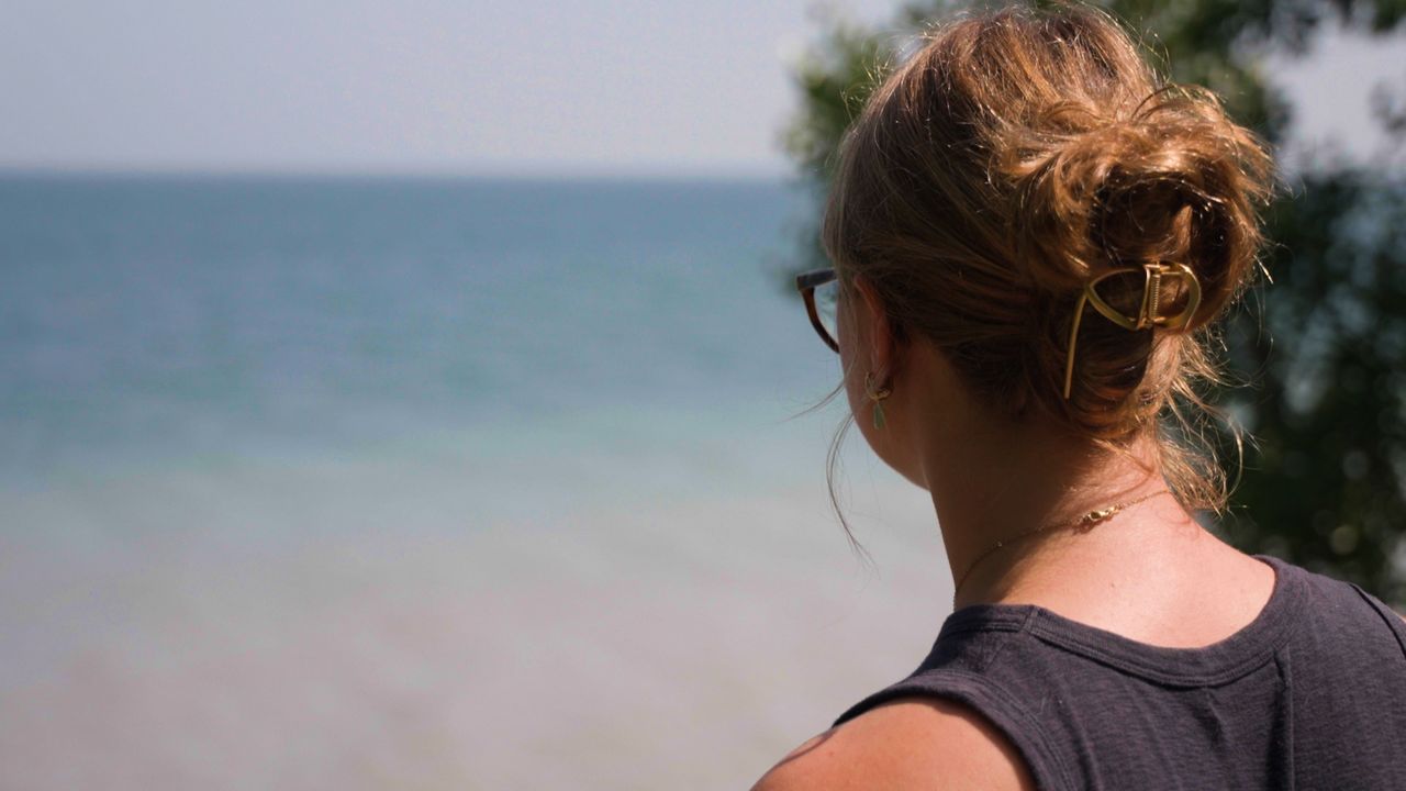 Intern Samantha Holtz looks out over Lake Erie