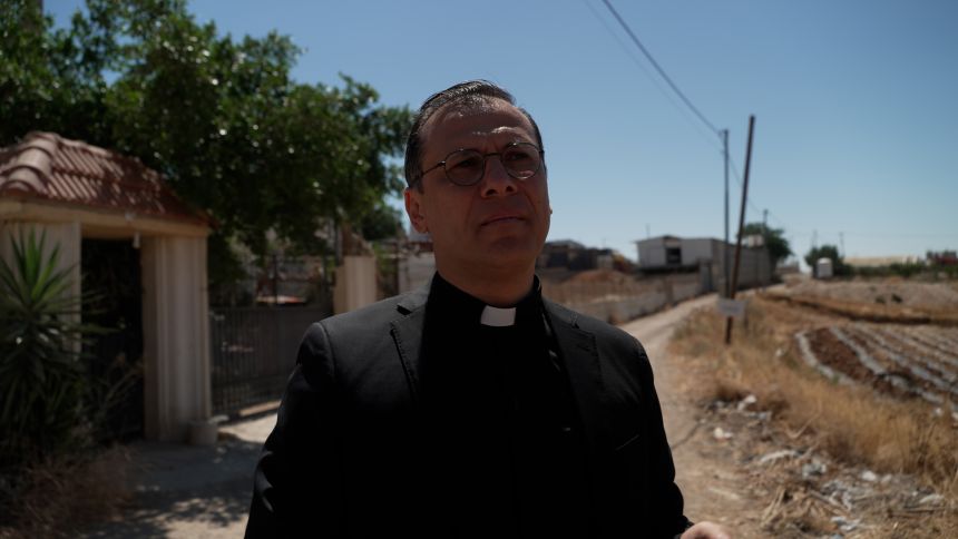 Father Munther Isaac says a lot of the land around Beit Sahour where he played as a boy has been taken over for settlements.