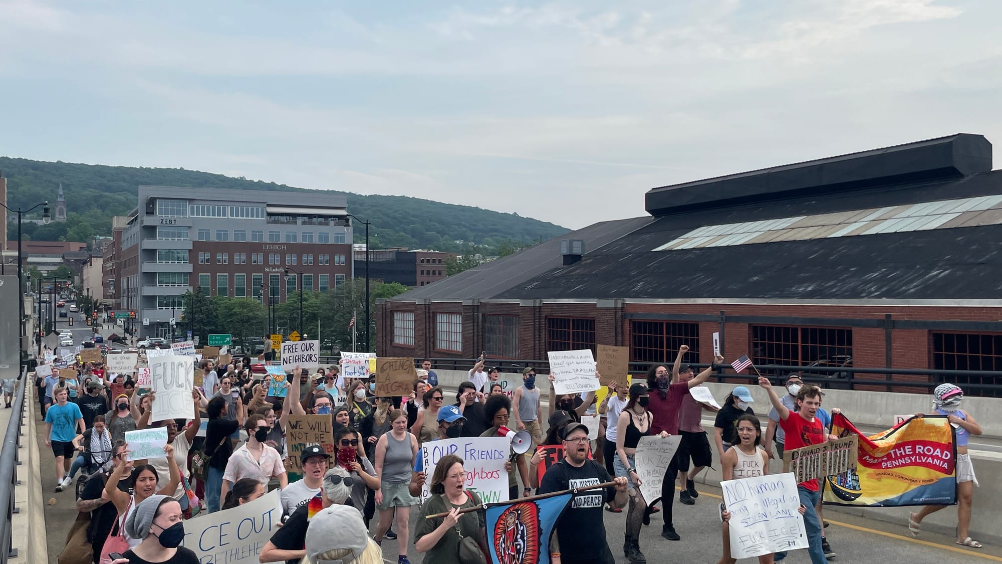 Residents gathered at a rally in Bethlehem on Thursday, June 12 to protest a federal immigration raid at the fire-damaged Fiv