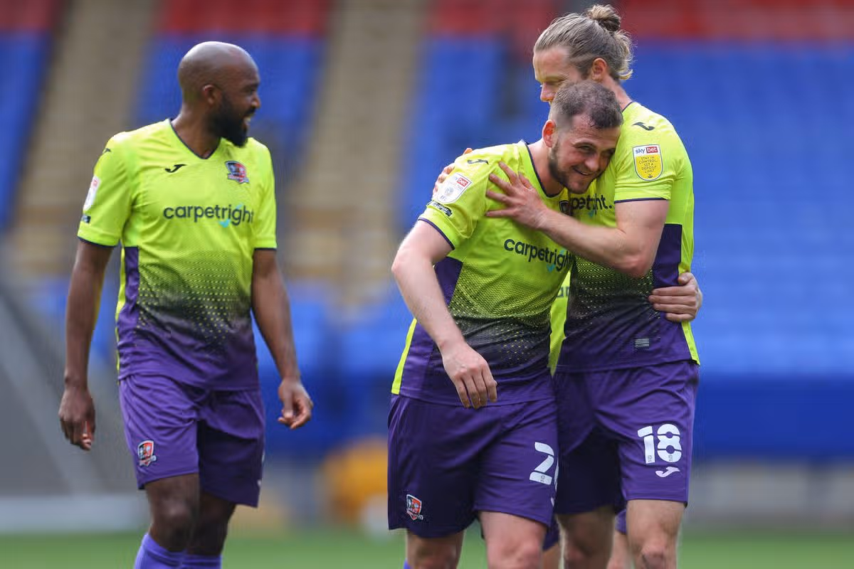 Pierce Sweeney celebrates his late winner for Exeter City at Bolton Wanderers in 2021