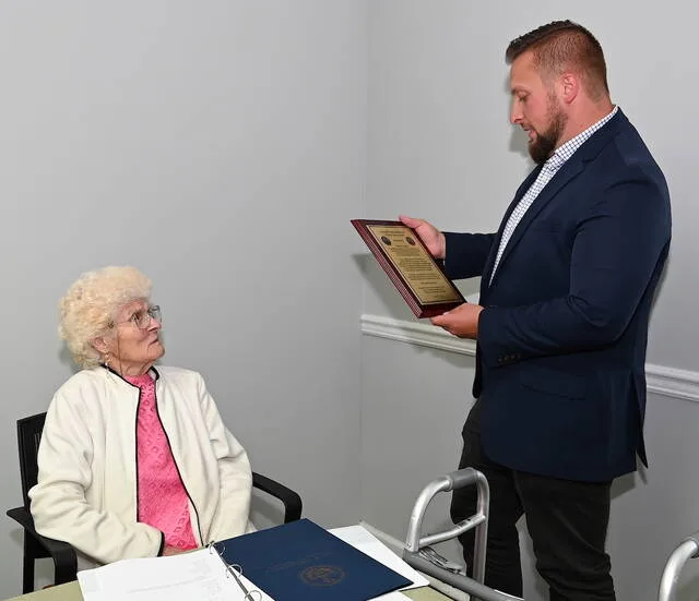 <p>Hughestown Borough Manager Joey Jones reads off a plaque from the borough to Councilwoman Marie Griglock for her years of service with gratitude to Hughestown.</p>
<p>Tony Callaio | For Sunday Dispatch</p>