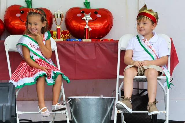 <p>Previous Little Miss and Mr. Tomato winners McKenzie Malloy (left) and Beckham Yates (right) sit on stage before this year’s pagaent begins.</p>
<p>Margaret Roarty | Sunday Dispatch</p>