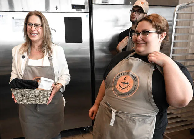 <p>First Lady of Pennsylvania Lori Shapiro receives a gift basket from Coffee Inclusive’s Katelynn Smith, right, on Monday as she made several stops in Pittston and Scranton.</p>
<p>Tony Callaio | For Times Leader</p>