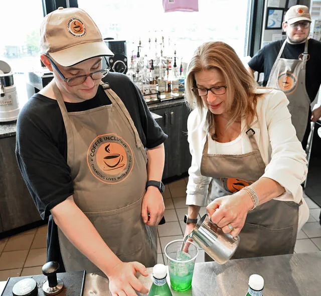 <p>Coffee Inclusive employee D.J. Jones helps Pennsylvania First Lady Laurie Shapiro make her first beverage at Coffee Inclusive at the City of Pittston location on Kennedy Boulevard on Monday.</p>
<p>Tony Callaio | For Times Leader</p>