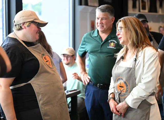 <p>A Lori Shapiro, right, who made stops in Pittston at Coffee Inclusive and Scranton on Monday, speaks to Coffee Inclusive employee Christina Wesley, left, along with State Rep. Jim Haddock.</p>
<p>Tony Callaio | For Times Leader</p>