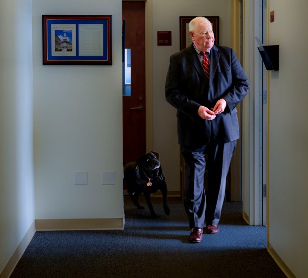 Lehigh County District Attorney Jim Martin spends a few moments with Ramona, the office's courthouse companion, Monday, Dec. 4, 2023, in Allentown. (April Gamiz/The Morning Call)