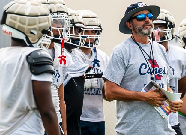Liberty's coach Shawn Daignault talks to his players as they run drills Thursday, Aug. 13, 2026, during Liberty high school football practice in Bethlehem (April Gamiz/The Morning Call)