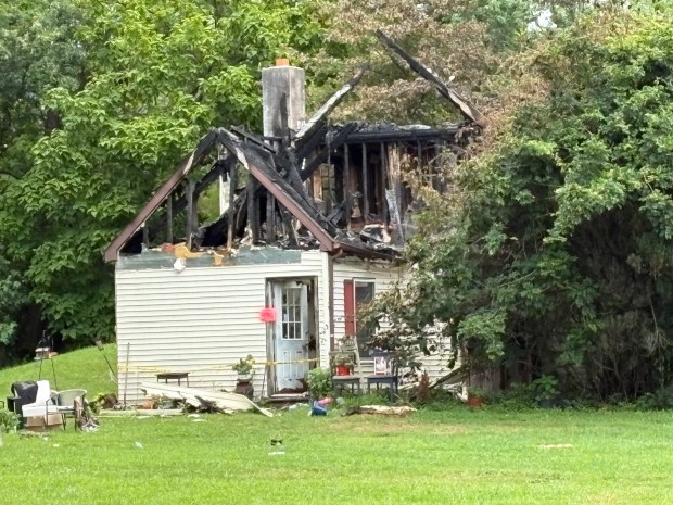A home in the 300 block of Furnace Road in Robeson Township is in ruins after a predawn blaze on Sunday, Aug. 16, 2026. (BILL UHRICH - READING EAGLE)