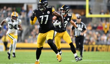 Aug 13, 2026; Pittsburgh, Pennsylvania, USA; Pittsburgh Steelers offensive tackle Broderick Jones (77) looks for someone to block as tight end Robert Tonyan (83) carries the ball during the first half of a game against the Green Bay Packers at Acrisure Stadium.