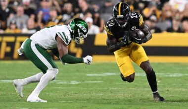 Aug 21, 2026; Pittsburgh, Pennsylvania, USA; Pittsburgh Steelers running back Kaleb Johnson (20) is tackled by New York Jets safety Andre Cisco (8) during the third quarter at Acrisure Stadium.
