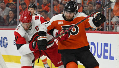 May 7, 2026; Philadelphia, Pennsylvania, USA; Carolina Hurricanes center Jordan Staal (11) and Philadelphia Flyers defenseman Jamie Drysdale (9) battle during the second period in game three of the second round of the 2026 Stanley Cup Playoffs at Xfinity Mobile Arena. Mandatory Credit: Eric Hartline-Imagn Images