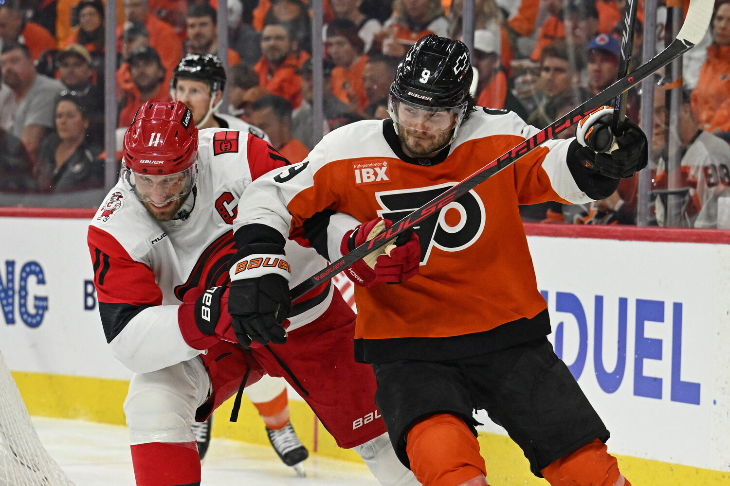 May 7, 2026; Philadelphia, Pennsylvania, USA; Carolina Hurricanes center Jordan Staal (11) and Philadelphia Flyers defenseman Jamie Drysdale (9) battle during the second period in game three of the second round of the 2026 Stanley Cup Playoffs at Xfinity Mobile Arena. Mandatory Credit: Eric Hartline-Imagn Images