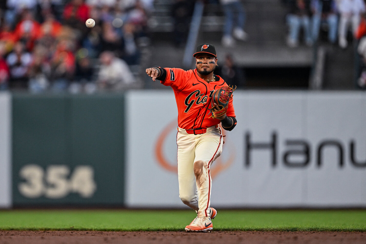 San Francisco Giants second baseman Luis Arraez (1) throws the ball to first for the out in the top of the third inning Los Angeles Angels at Oracle Park.