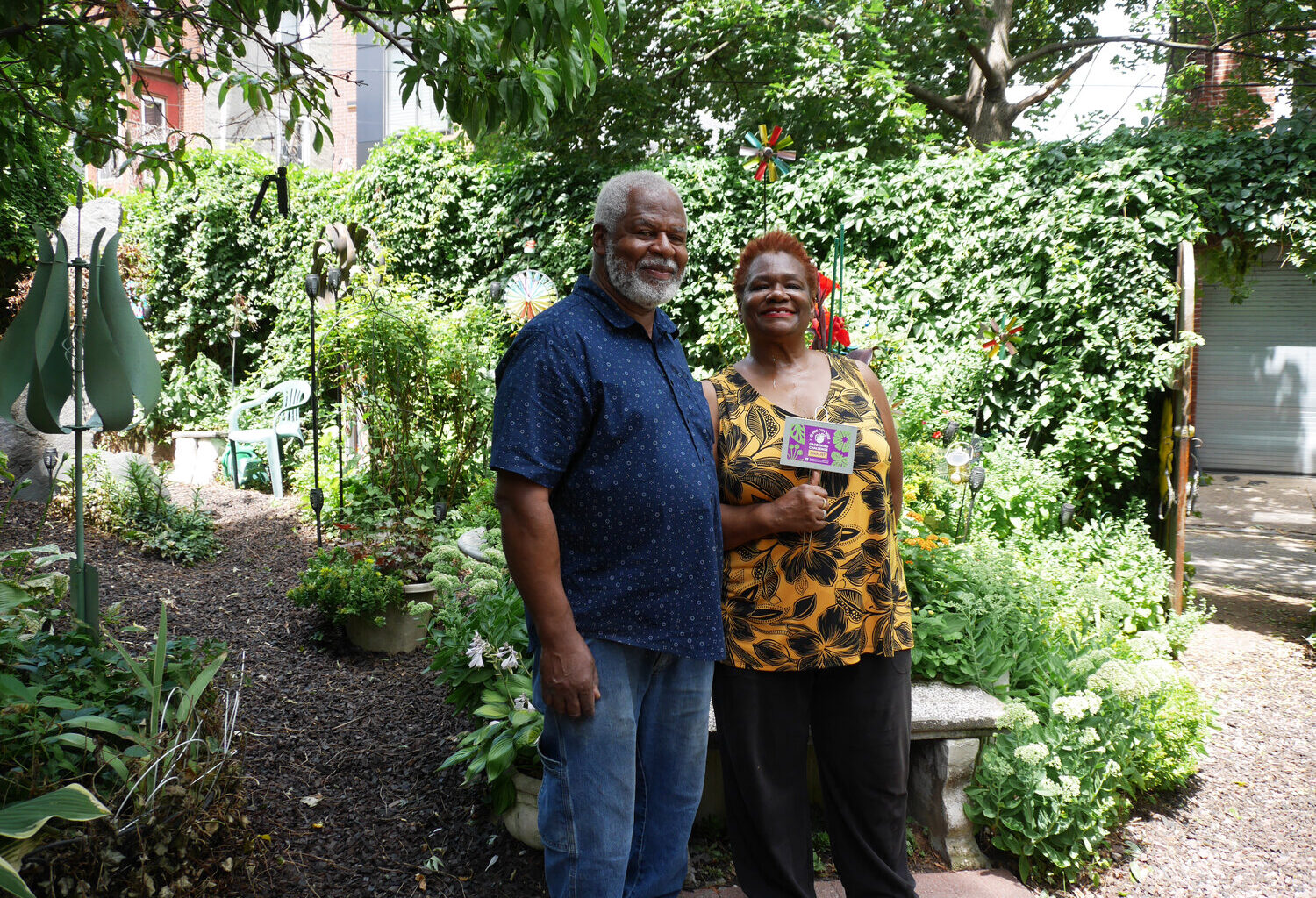 Bill and Bernadette Briscoe are shown in the garden outside their North Philly home.