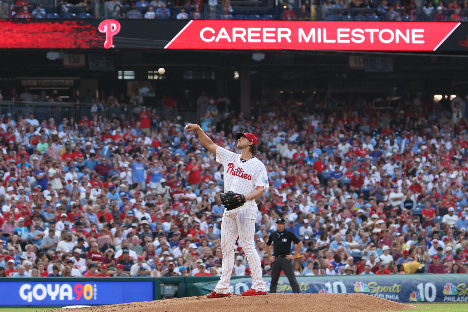 Philadelphia Phillies pitcher Aaron Nola (27) tosses his ball into the dugout after recording his 2000 career strike out during the second inning against the Toronto Blue Jays at Citizens Bank Park.