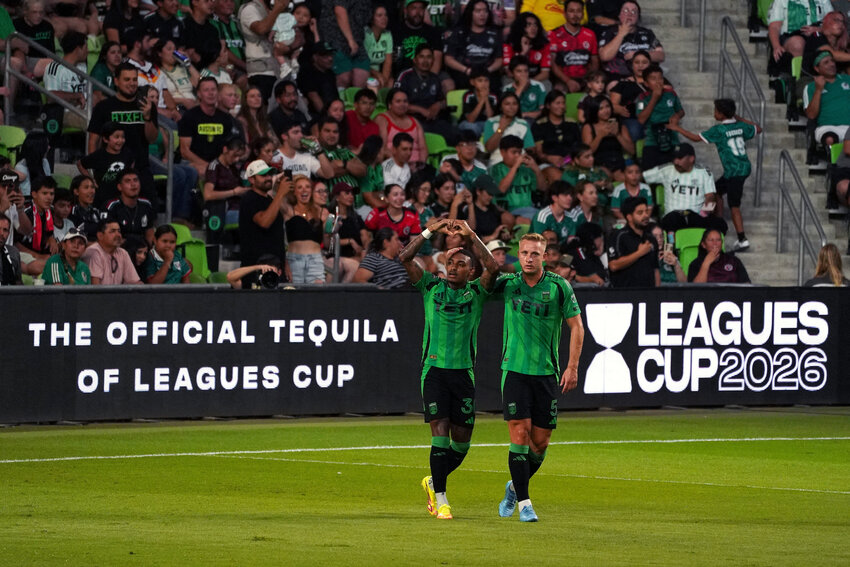 Austin FC midfielder Joseph Rosales (30) acknowledges the crowd with defender Oleksandr Svatok (5) after scoring a goal against Club Tijuana during the first half of a Leagues Cup Phase One match against Club Tijuana at Q2 Stadium.