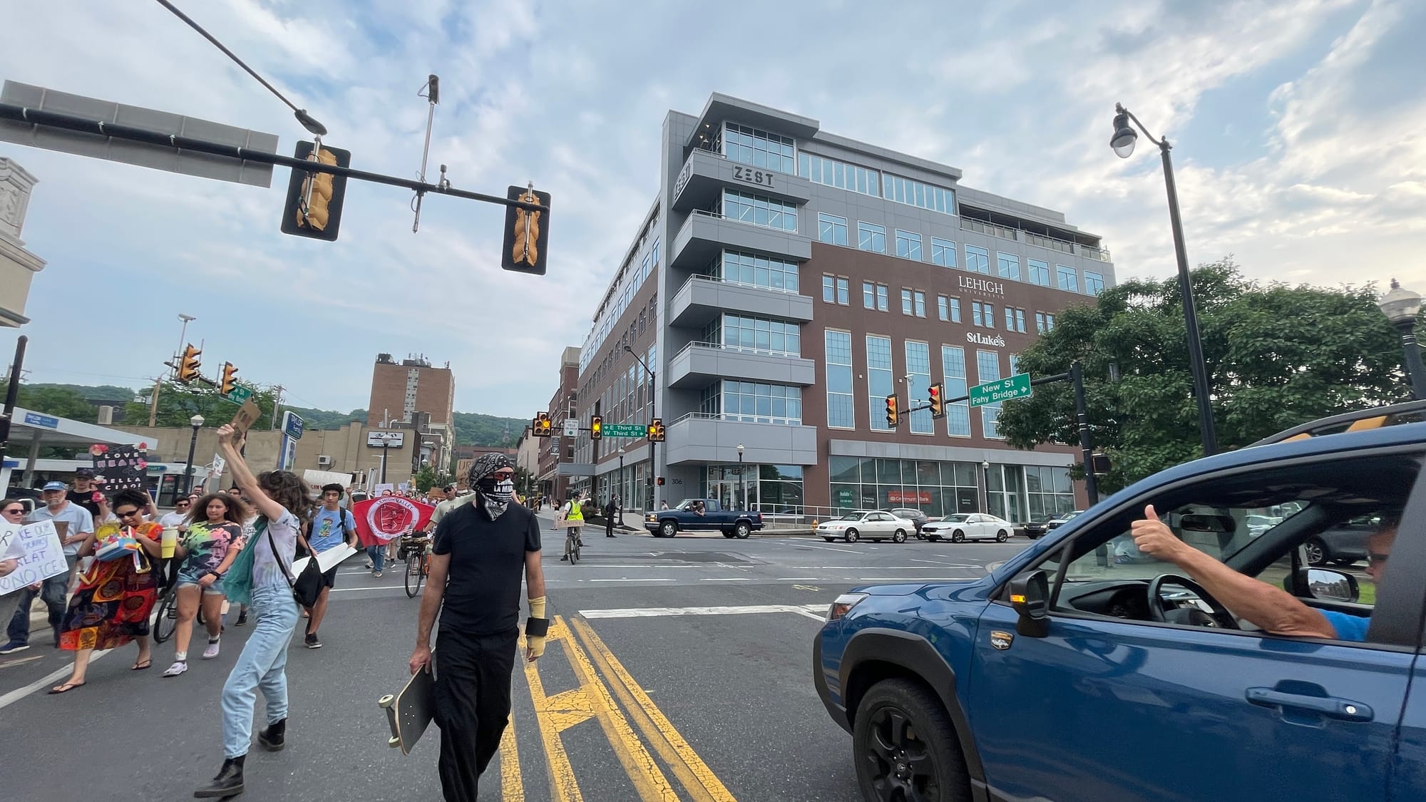 Residents gathered at a rally in Bethlehem on Thursday, June 12 to protest a federal immigration raid at the fire-damaged Fiv