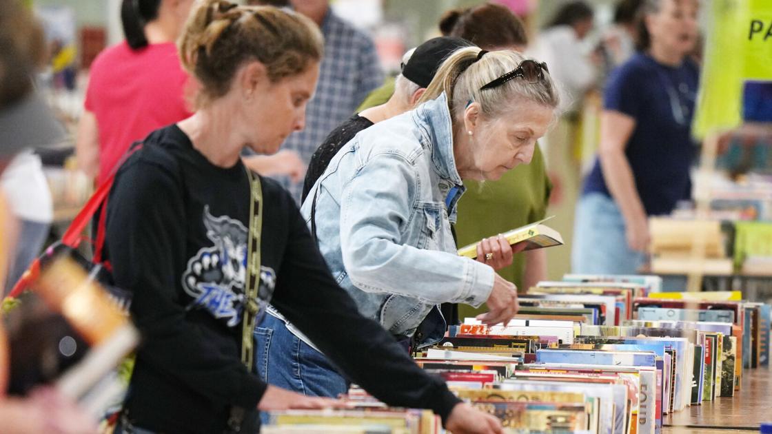 Shoppers look for book bargains during the Great American Book Sale inside the Flo Fabrizio Ice Center in Erie, Pa., on June 14, 2026. - Arizona Daily Star