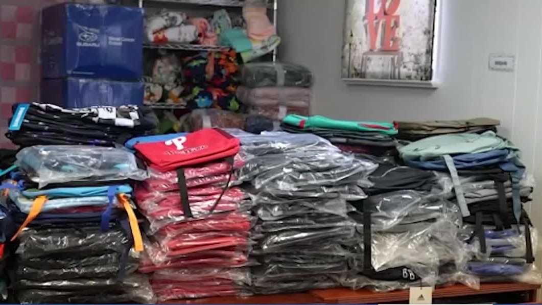 Volunteers in Philadelphia prepare personalized backpacks for children