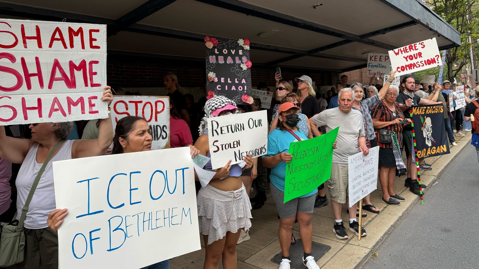 Residents demonstrate at a rally Thursday, June 12, to protest a federal immigration raid at the fire-damaged Five10 Flats ap