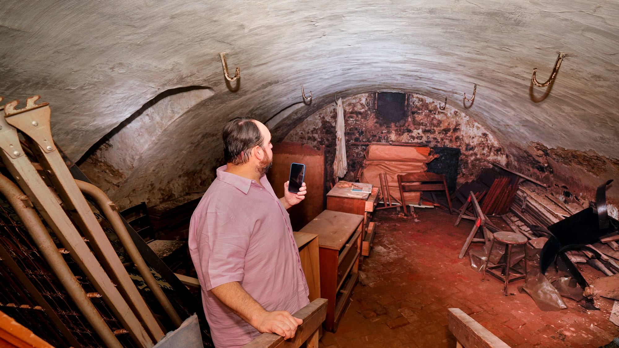 Mike Cook gives a tour of a domed room in the basement of the Brethren House. Tour of the 1748-built Brethren House at Church