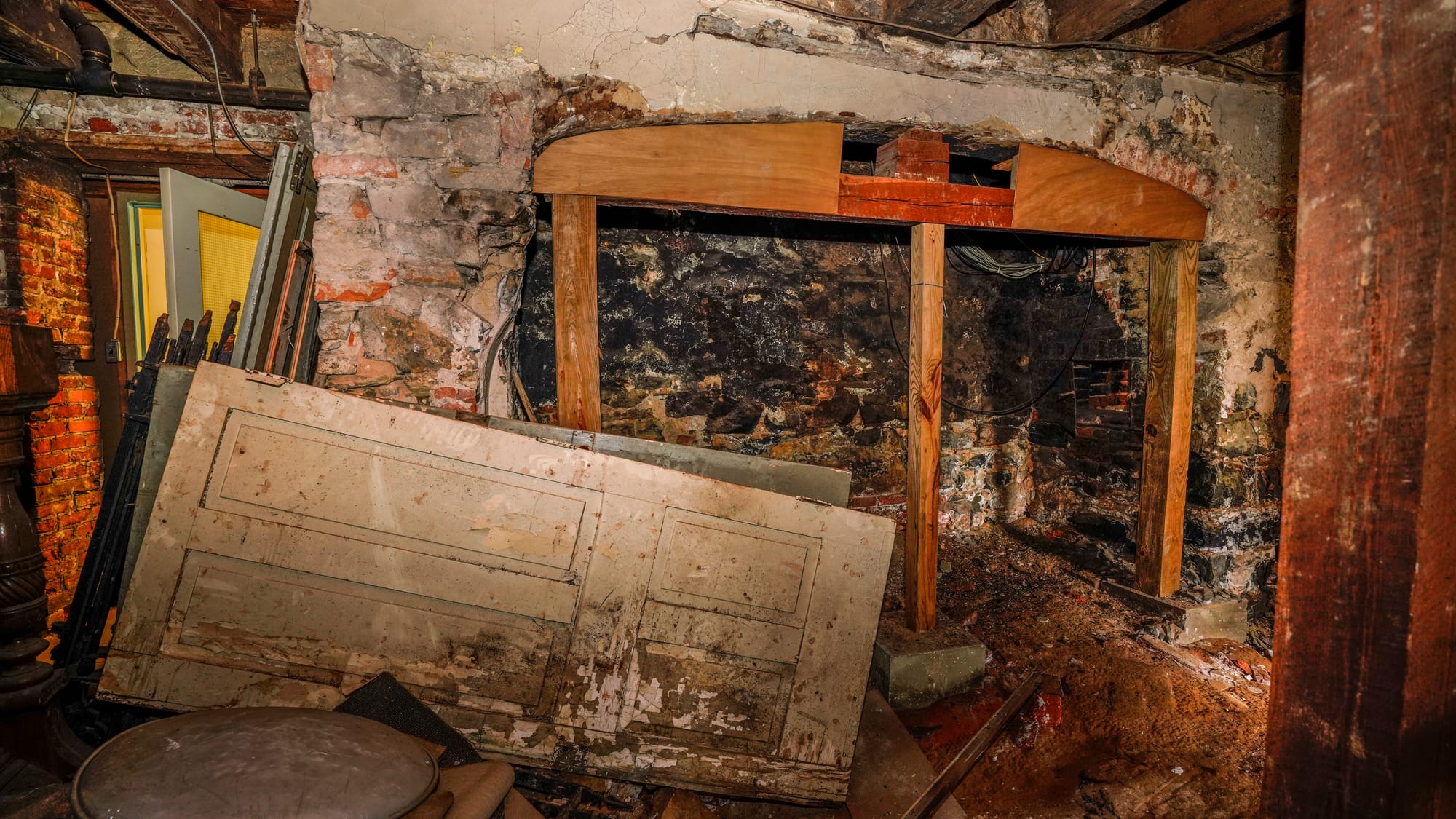 One of four large fireplaces that heated the Brethren House which was uncovered from under plaster possibly in the 1970s. Tou