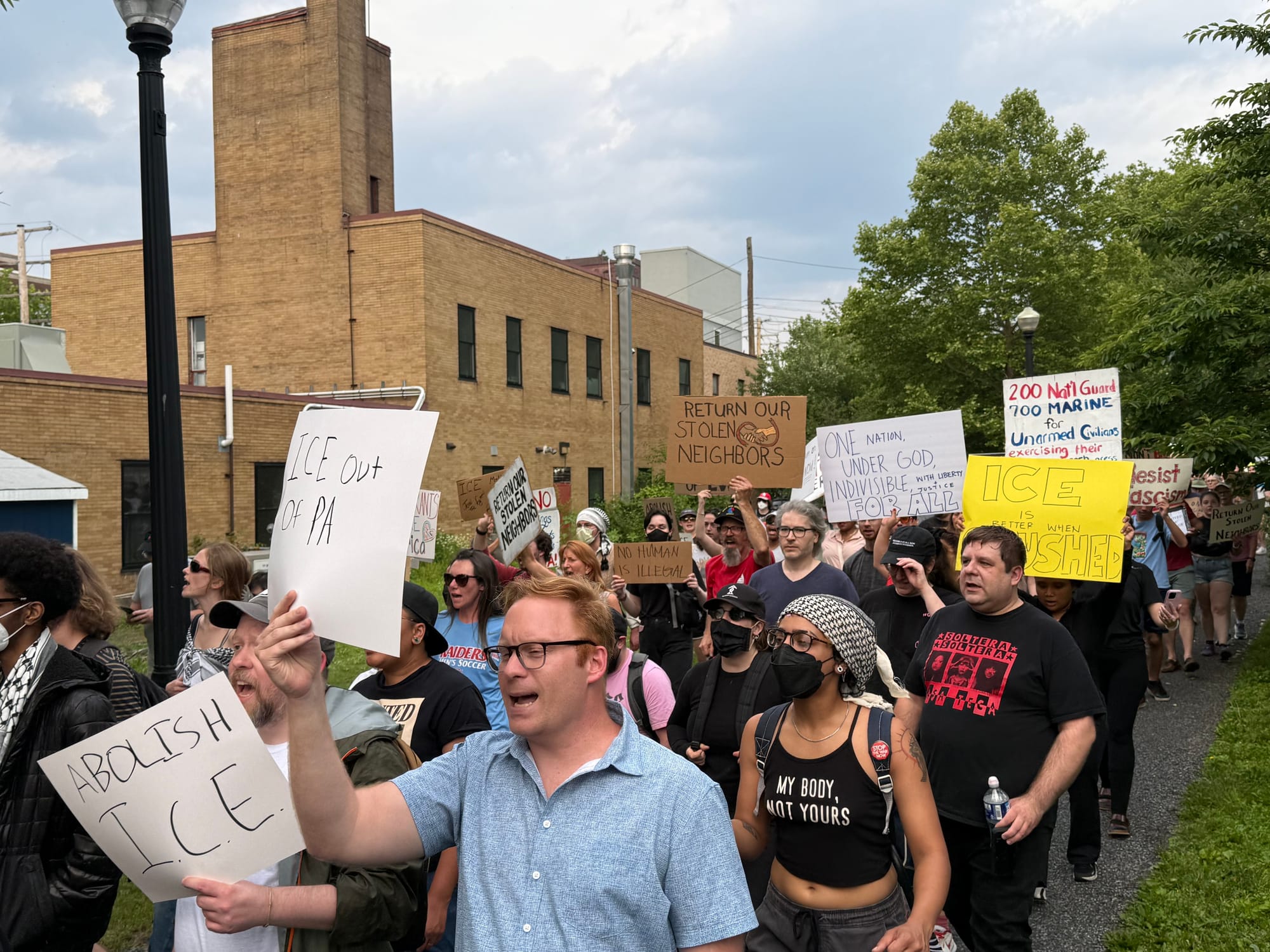 Residents gathered at a rally in Bethlehem on Thursday, June 12 to protest a federal immigration raid at the fire-damaged Fiv