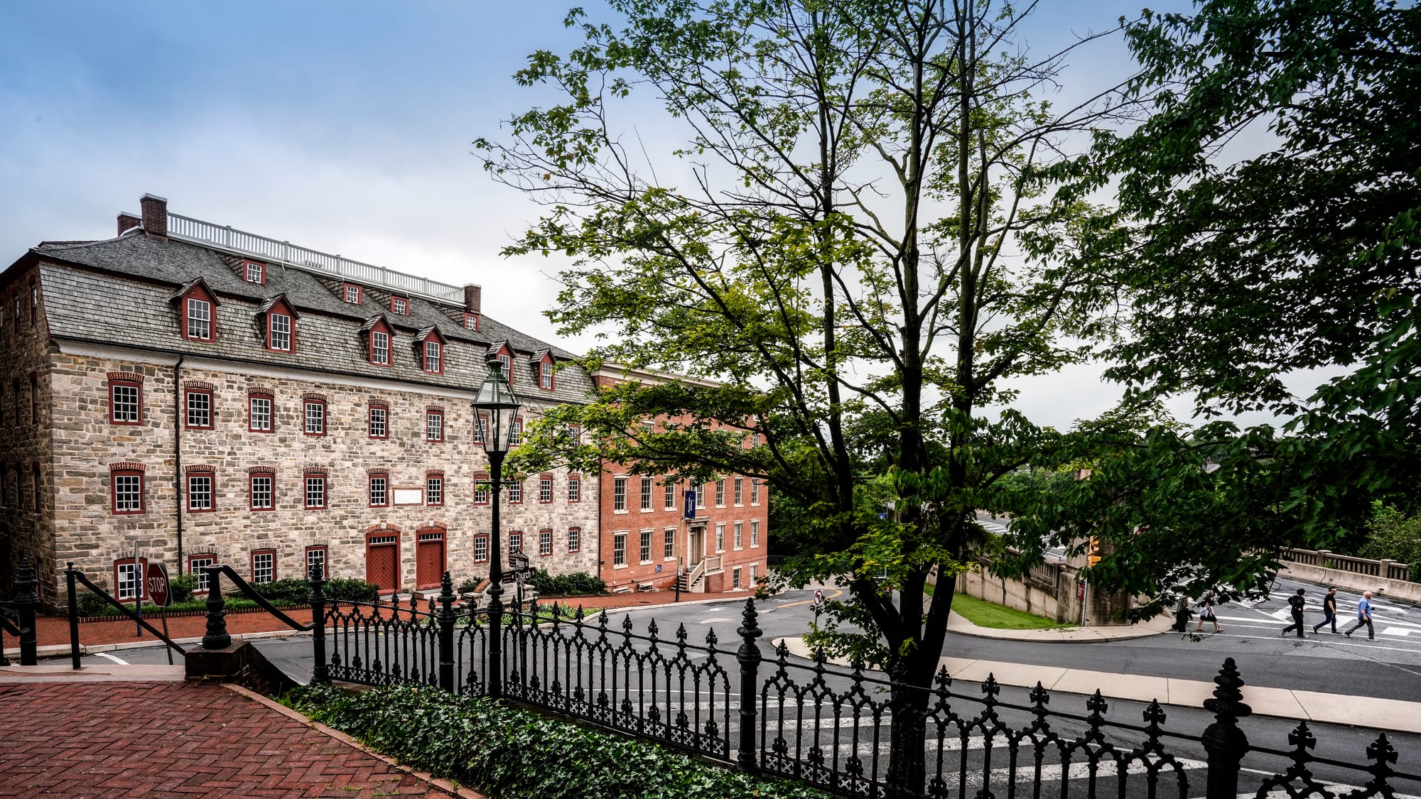 Tour of the 1748-built Brethren House, left, at Church and Main Streets in Bethlehem, Pa. on Wednesday, June 18, 2025. Photog