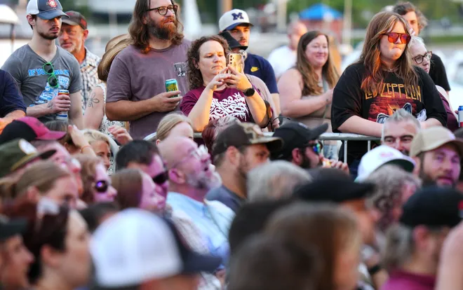 Music fans listen as Old Crow Medicine Show band members perform at the Rebich Investments Amphitheater in Erie, Pa., on Aug. 5, 2026.