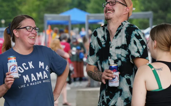 Karen Ambrose, 41, left, hangs out with her son Austin Ambrose, 25, and daughter Anna-Luciah Ambrose, 17, prior to Old Crow Medicine Show performing at the Rebich Investments Amphitheater in Erie, Pa., on Aug. 5, 2026.