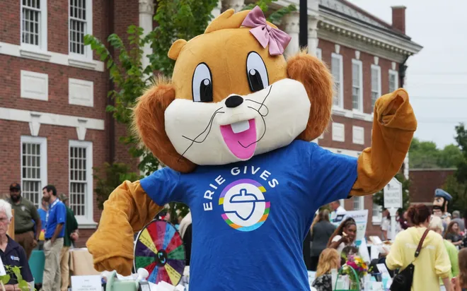 The Erie Community Foundation squirrel mascot dances on East Sixth Street during an Erie Gives community celebration at the Erie Insurance campus in Erie, Pa., on Aug. 11, 2026. More than 500 nonprofit organizations benefit from donors and matching foundation funds. Here, the author praises donors for supporting the community.