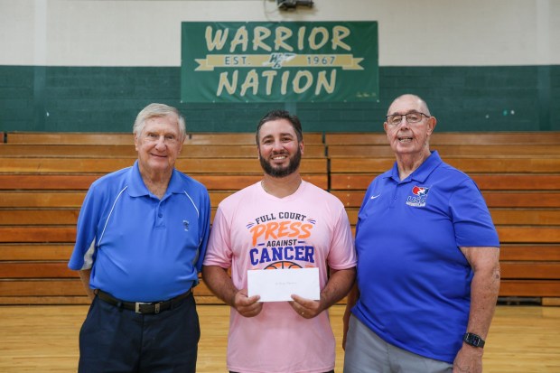 From left: John Zimich, of the WVAA, Anthony Macario, Wyoming Area basketball coach, and Patrick Rushton, of the WVAA, at Wyoming Area High School on Wednesday, Aug. 19, 2026. (JASON ARDAN / STAFF PHOTOGRAPHER)