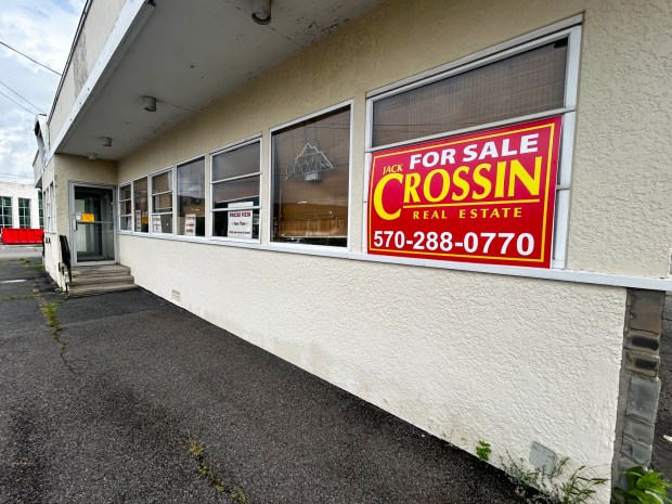 A 'For Sale' sign is placed in the window near the entrance of Victory Pig Pizza and Barbecue in Wyoming Monday, August 3, 2026. (SEAN MCKEAG / STAFF PHOTOGRAPHER)