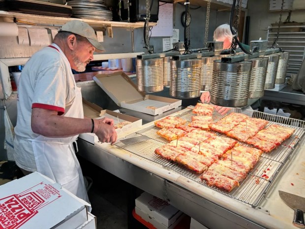 Victory Pig pizza owner Richard Ceccoli, left, confirmed the business will soon close. (BOB KALINOWSKI / STAFF PHOTOGRAPHER)